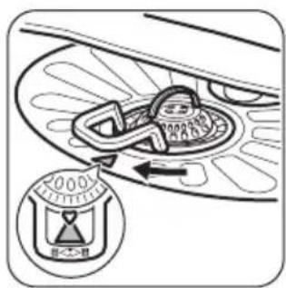 Diagram showing a car interior with a valve and directional arrow, including a labeled control dial.