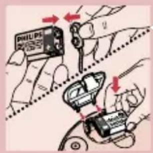 Diagram showing hands using a Philips battery to switch and adjust a small electronic component, with red arrows indicating the process.