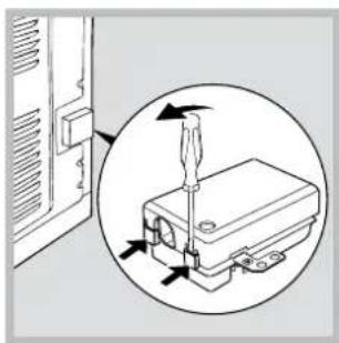 Diagram showing a screwdriver inserted into a device component, with arrows indicating direction (no text or symbols present)