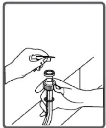 Line drawing of hands holding a tool over a mechanical component (no text or symbols)