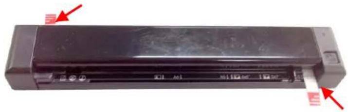 Exterior view of a black rectangular electronic device with red arrows pointing to its side (no visible text or symbols)