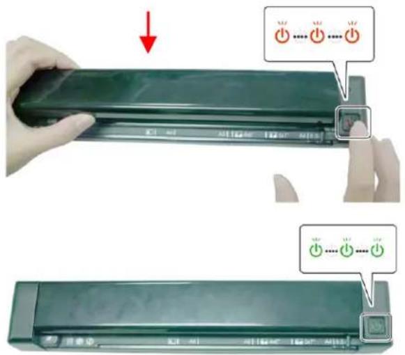 Diagram showing a hand holding a green remote control panel with three red indicator lights and Chinese text labels.