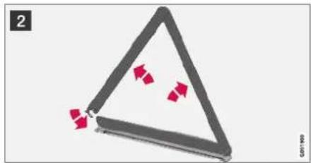 Triangular object with red arrows pointing inward, no visible text or symbols