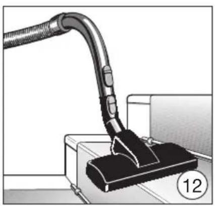 Illustration of a vacuum cleaner inserting a component into a device (no text or symbols visible).