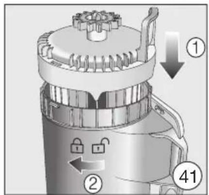 Technical diagram of a mechanical device with numbered parts and directional arrows indicating components.