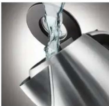 Close-up of a metallic mechanical component with a glass pouring liquid (no text or symbols visible)