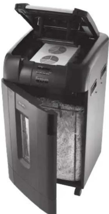 Black and white photo of a digital scanner with open lid, showing internal components and paper sheets (no visible text or symbols)