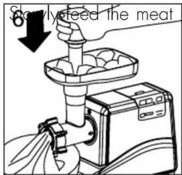 Slowly feed the meat