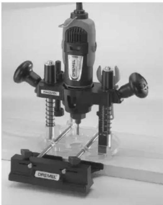 Black Dremel drill press tool with multiple drill heads and a base (no visible text or symbols)