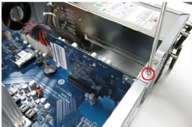Close-up of an electronic circuit board with a power supply unit and a red circle highlighting a component (no visible text or symbols)