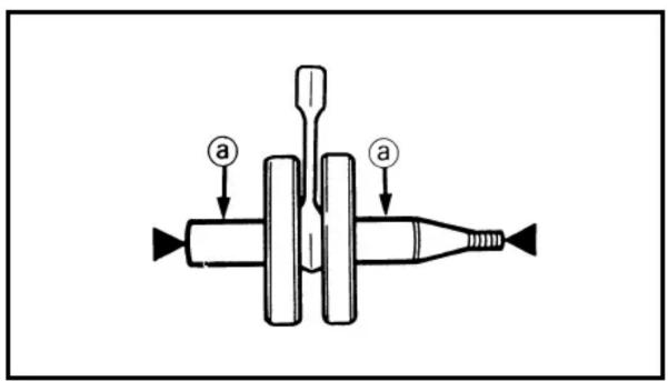 Diagram of a mechanical device with labeled parts 'a' and directional arrows indicating movement or force.