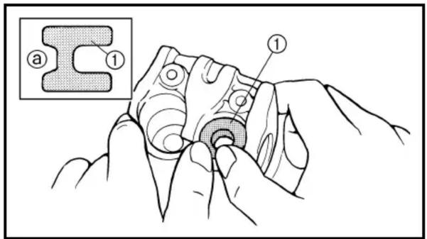 Technical diagram showing a mechanical assembly with labeled parts (a, 1) and a magnified inset of a mechanical part.