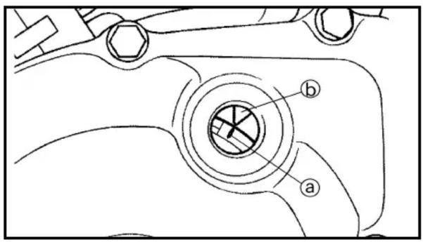 Technical diagram of a mechanical component with labeled parts a and b