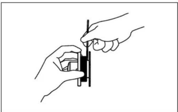 Line drawing of two hands installing or adjusting a component with a tool (no text or symbols)