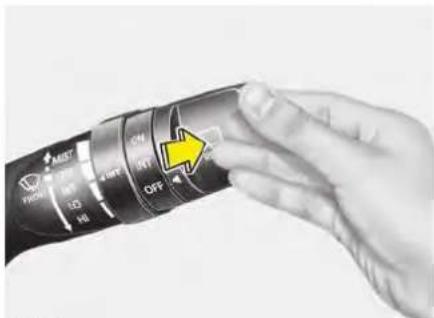 Close-up of a hand holding a camera lens with control buttons and a yellow arrow indicating 'OFF' action.