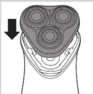 Diagram of a hand holding a three-pin electric shaver with a downward arrow indicating compression (no text or symbols present)