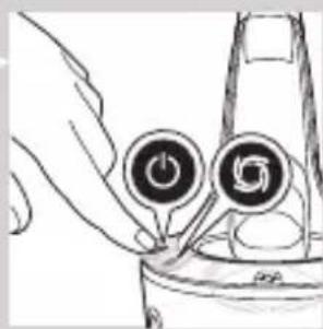 Line drawing of a hand holding two circular buttons with spiral symbols, connected to a device, no text or labels.