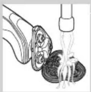Illustration of a food item being lifted from a tube into a bowl (no text or symbols).
