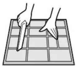 Illustration of two hands using a tool on a grid-patterned surface (no text or symbols)