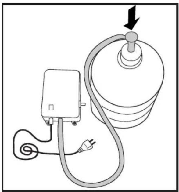 Diagram of a medical or electrical device connected to a cylindrical device with a power outlet, showing no text or symbols.