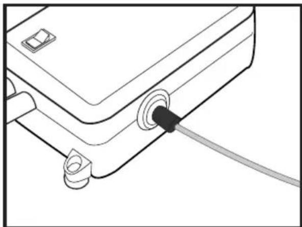 Line drawing of a device with a cable inserted into a connector.