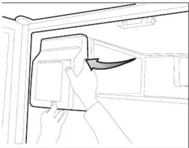 Line drawing of a hand inserting a device into a cabinet.