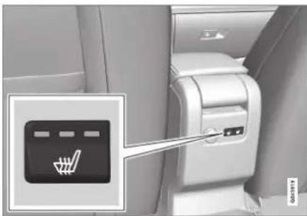 Photo of a flight attendant seat with a control panel and a hand icon pointing to the seat.