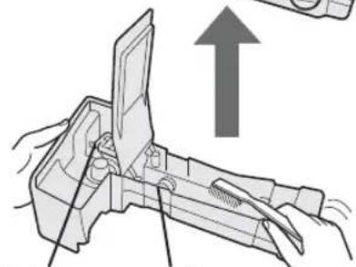 Illustration of hands using a tool to adjust or install a mechanical component, with an upward arrow indicating motion.