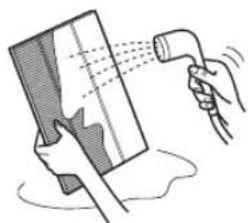 Illustration of a hand spraying water onto a surface with a tool (no text or symbols)