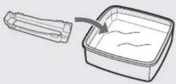 Diagram showing a container with internal wavy lines and an arrow indicating direction (no text or symbols)