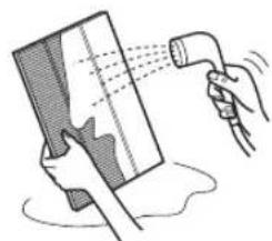 Illustration of a hand spraying water onto a surface with a tool (no text or symbols).