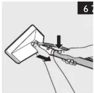 Illustration of a hand using a tool to lift a piece of paper (no text or symbols present).