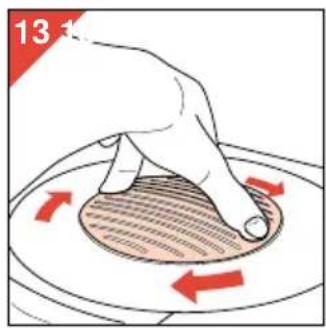 Hand pressing down on a circular object with red arrows indicating rotation (no text or symbols).