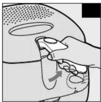 Illustration of a hand using a tool to interact with a device, showing motion arrows (no text or symbols)