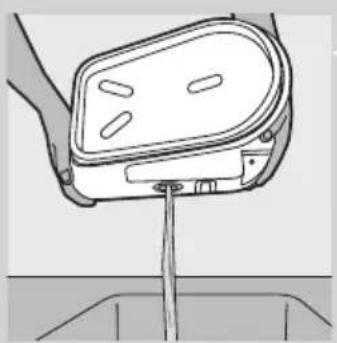 Diagram of a hand holding a device with a vertical rod inserted into a container (no text or symbols visible)