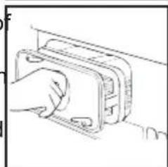 Line drawing of a hand inserting a rectangular component into a housing (no text or symbols)