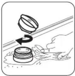 Illustration of a hand cleaning a container with a rotating knob (no text or symbols)