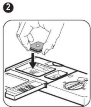 Diagram showing a hand placing a component into a device with labeled parts and a downward arrow indicating direction.