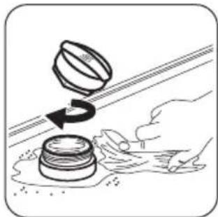 Illustration of a hand cleaning a wall-mounted device with a rotating knob.