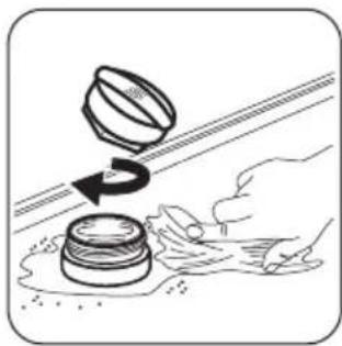 Illustration of a hand pressing down on stacked containers with a rotating knob (no text or symbols)