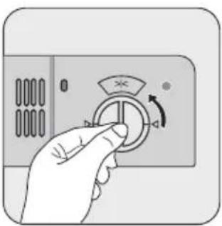 Hand holding a circular control knob with an arrow indicating clockwise rotation (no text or symbols)