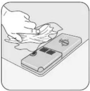 Illustration of a hand using a tool to clean or store items on a flat surface (no text or symbols visible)