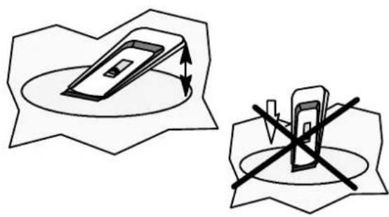 Two technical diagrams showing a device with an arrow and cross symbol, no text or labels present.