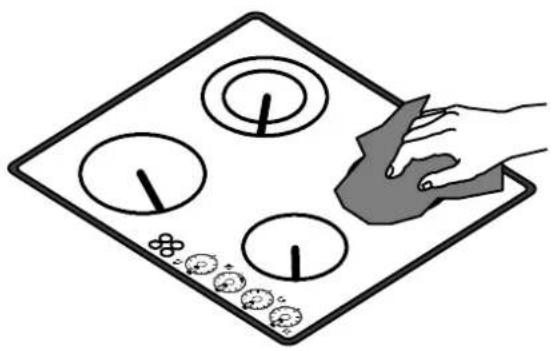 Illustration of a hand placing a small object on a grid board with circular elements (no text or symbols)