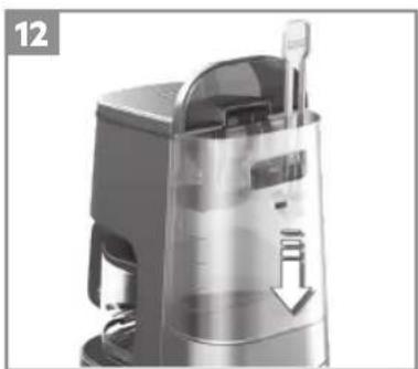 Close-up of a modern kitchen appliance with a downward arrow indicating a drop or reduction (no text or symbols visible)