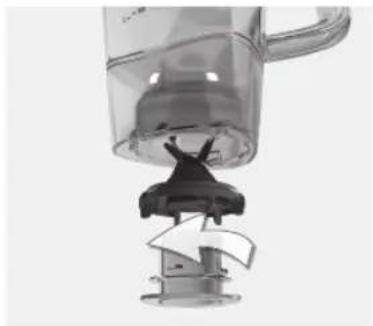 Close-up of a small kitchen blender with a handle and lid, showing internal components.