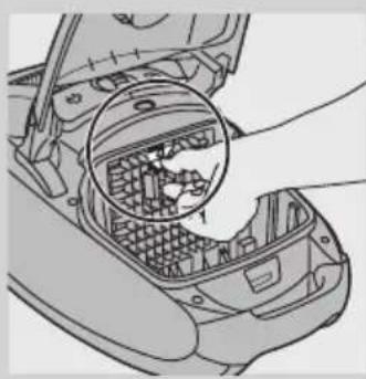 Line drawing of a car interior showing a hand inserting a component into the engine compartment.
