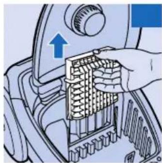 Illustration of a hand inserting a grid into a vehicle engine compartment (no text or symbols visible)