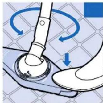 Illustration of a hand turning a mechanical component with blue arrows indicating rotation (no text or symbols)