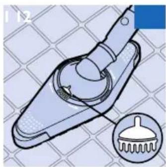 Illustration of a mechanical clamp or lever mechanism with a magnified inset showing a brush tip (no text or symbols)